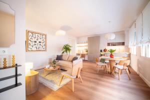 a living room with a couch and a table at Genesis-Loft Madrid in Madrid