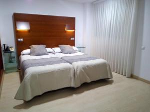 Voodi või voodid majutusasutuse Nap Oviedo toas