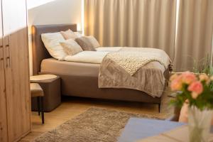 a bedroom with a bed with pillows on it at Uelser Hof in Uelsen
