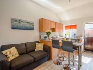 a living room with a couch and a kitchen at 2 Bed in Louth oc-53508 in Fotherby