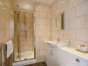 a bathroom with a sink and a shower at 2 Bed in Louth oc-53508 in Fotherby +9 photos