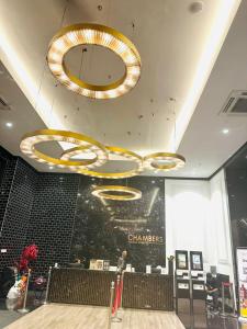 a restaurant with two large chandeliers hanging from the ceiling at Chamber Haven KL in Kuala Lumpur +81 photos
