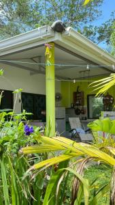 a house with a green and white at Similan Home Stay in Ban Lam Ru (1)