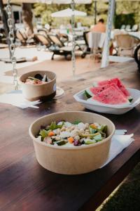 a table with three bowls of food on it at Hotel Acquario in Vasto