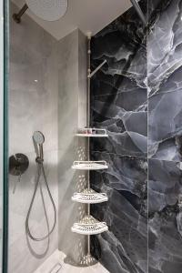 a bathroom with a shower with a shower at Akrogiali Apartments in Bali +60 photos