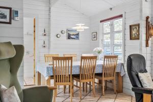 a dining room with a table and chairs at OH357-Storvorde-Hybenvej-40 in Storvorde