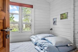 a room with two pillows on the floor in front of a window at OH357-Storvorde-Hybenvej-40 in Storvorde