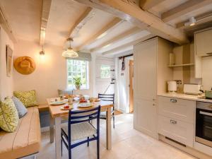 a kitchen and dining room with a table and chairs at 2 Bed in Salisbury oc-88922 in Boreham