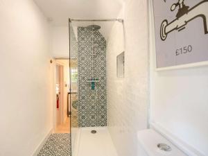 a shower with a glass door in a bathroom at 2 Bed in Salisbury oc-88922 in Boreham +16 photos
