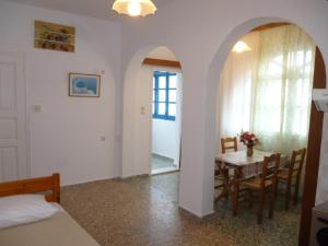 a room with a table and a dining room at Vasilis Ios Place II in Ios Chora +64 photos