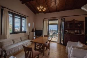 a living room with a couch and a table at Nikiana Panorama in Nikiana +7 photos