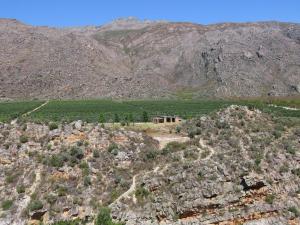 an aerial view of a house on a mountain at Klipspringer Cottage in Prince Alfreds Hamlet