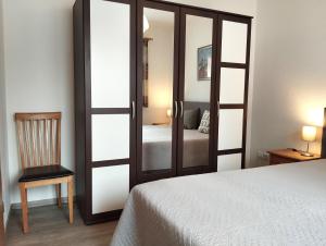 a bedroom with a sliding glass door with a bed at Ferienwohnung Törpsch in Pirna
