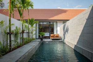 a swimming pool in the backyard of a house at Two Seasons Siem Reap Hotel in Siem Reap