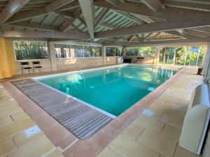 an overhead view of a swimming pool in a house at Le Colombier d'Antan in Les Vans