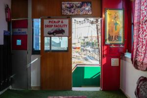 a door to a shop with a sign on it at Hotel satkar in Parāsia