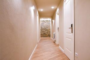 a long hallway with a brick wall at Agriturismo De Ferrari in Onzo
