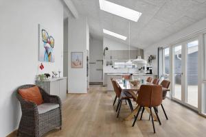 a kitchen and dining room with a table and chairs at OH513-Hadsund-Haslevgarde-Eng-14 in Hadsund