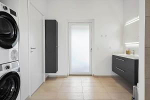 a laundry room with a washer and dryer at OH513-Hadsund-Haslevgarde-Eng-14 in Hadsund