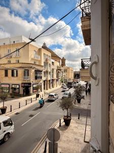 a view of a city street with cars on the road at Apartment 81 in Mosta