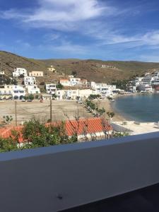 a view of a town and a body of water at Sea Sun Sand in Loutra