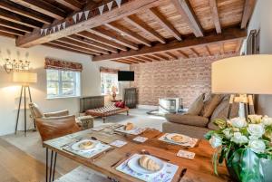 a living room with a wooden table and a couch at 2 Bed in Caenby oc-o35799 in Caenby