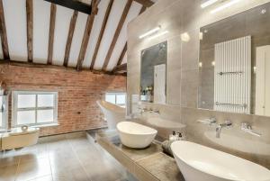 a bathroom with two sinks and two toilets at 2 Bed in Caenby oc-o35799 in Caenby +19 photos