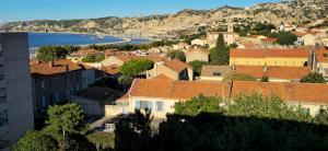 a town with a view of the water and buildings at Marseille Estaque in Marseille