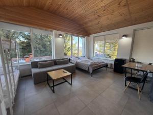 a living room with a couch and a table at Готель Яблуниця in Yablunytsya
