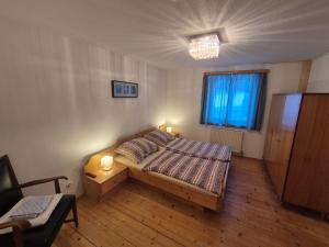 a small bedroom with a bed and a window at Spiss 21 in Spiss
