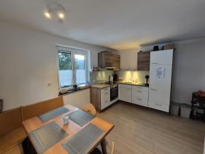 a kitchen with a table and a dining room at Spiss 21 in Spiss