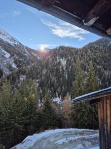 a view of the mountains from the porch of a house at Spiss 21 in Spiss