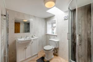 a bathroom with a toilet and a sink and a shower at 1 Bed in Staxton oc-w36041 in Salton +25 photos