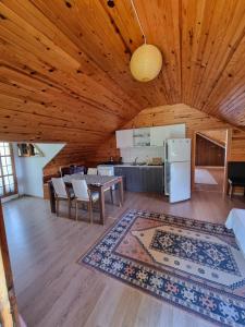 a large living room with a wooden ceiling at Şahmeran Pansiyon in Kemer