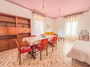 a dining room with a table and chairs at Orchidea 2 - Pineto Vacanza in Pineto +24 photos