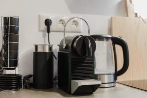 a toaster sitting on top of a kitchen counter at Stadtblick Passau Apartment in Passau