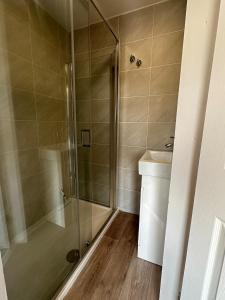 a bathroom with a shower and a sink at 3 bed house in Risca in Risca +14 photos