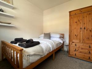 a bedroom with a bed with towels on it at 3 bed house in Risca in Risca