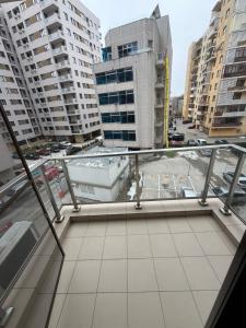 a balcony with a view of a city at Studio Residential Vitan in Bucharest