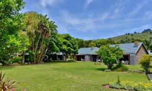 a home with a yard with a house at Baywater Village by MyResorts in Sedgefield