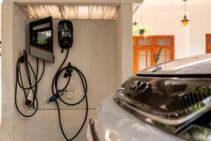 a room with a car hooked up to a tv at Kandy Golden Gate Resort in Kandy