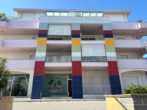 a building with colored squares on the front of it at PIOPPETO EST - Premium Villas in Giulianova