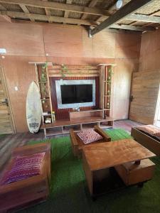 a large living room with a flat screen tv at Nana's House in San Isidro