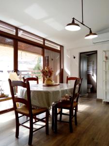 a dining room with a table with chairs and a tableablish at Hoya del Agua Casa Rural in Casas de Haro