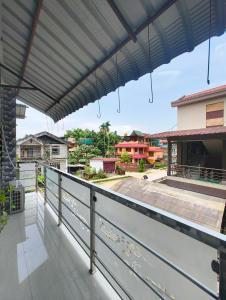a balcony with a view of a city at Aashray Independent Homestay Dibrugarh in Dibrugarh