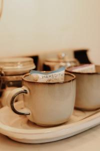 a group of coffee cups sitting on a plate at The Half Moon Inn in Dean