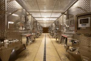 a long aisle in a train station with stalls at Winery La Gora in Irig +33 photos