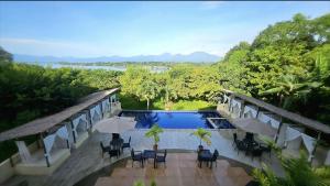 an aerial view of a resort with a swimming pool at Palawan Coliving - Palawan Coworking in Puerto Princesa City