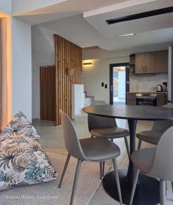 a dining room and kitchen with a table and chairs at Asteria Houses Samothraki in Samothraki