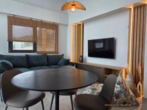 a living room with a table and a couch at Asteria Houses Samothraki in Samothraki